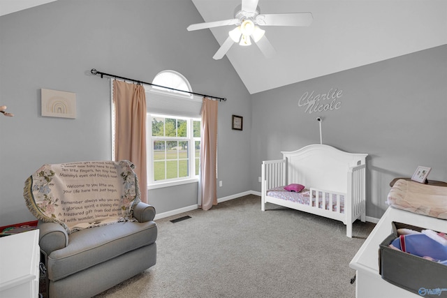 carpeted bedroom featuring high vaulted ceiling, a crib, and ceiling fan