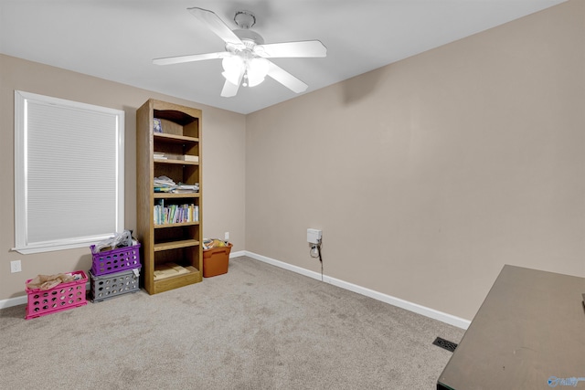 misc room featuring ceiling fan and light colored carpet