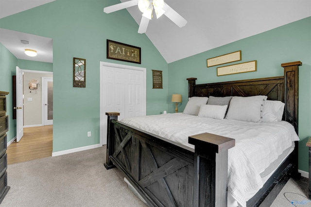 bedroom with high vaulted ceiling, a closet, ceiling fan, and light hardwood / wood-style floors