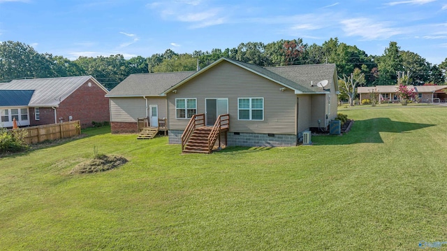 back of house featuring a lawn