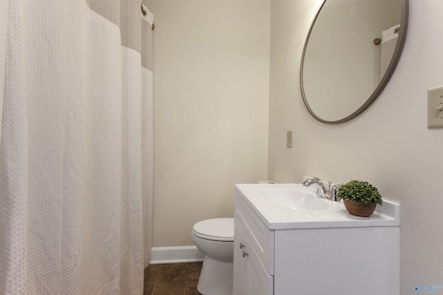 bathroom with tile patterned floors, vanity, and toilet