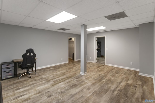 interior space with hardwood / wood-style flooring and a paneled ceiling