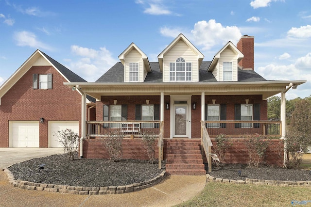 view of front of property featuring a porch and a garage