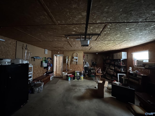 garage featuring cooling unit and a garage door opener