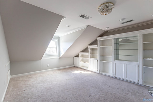 bonus room with vaulted ceiling and light colored carpet