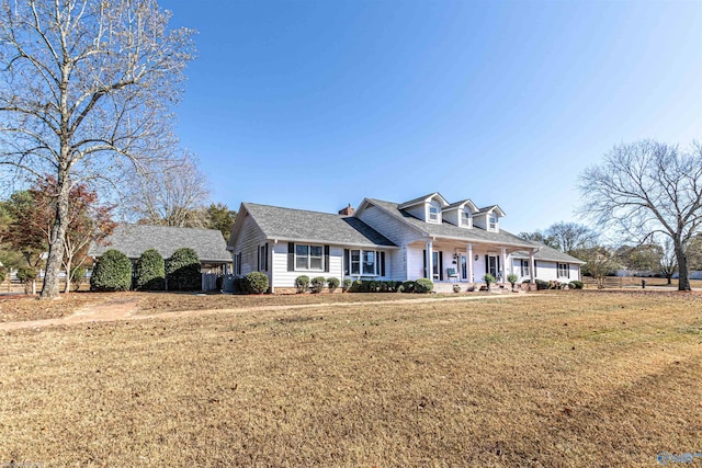 cape cod home with a front lawn and a porch