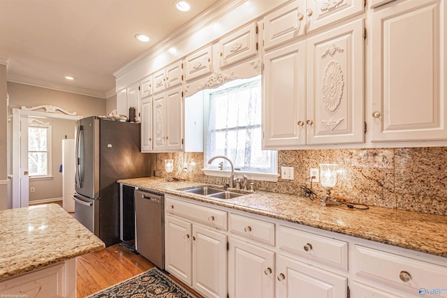 kitchen with white cabinetry, sink, and appliances with stainless steel finishes