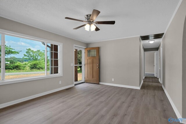 2221 Old Union Rd, Grant, AL 35747 - unfurnished room featuring wood finished floors, a ceiling fan, baseboards, and crown molding