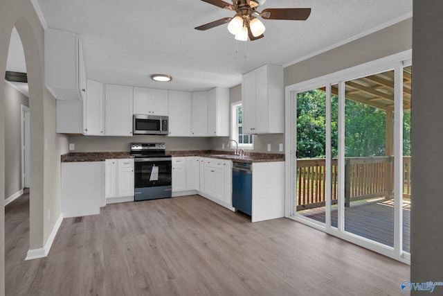 2221 Old Union Rd, Grant, AL 35747 - kitchen featuring stainless steel appliances, dark countertops, light wood-style floors, a sink, and ornamental molding