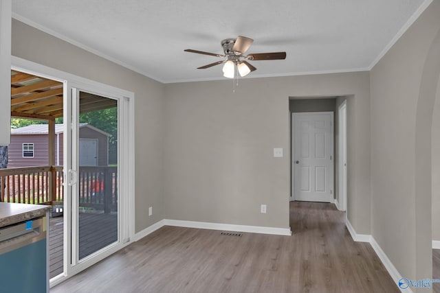 2221 Old Union Rd, Grant, AL 35747 - empty room with light wood finished floors, a ceiling fan, baseboards, and ornamental molding