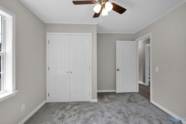 2221 Old Union Rd, Grant, AL 35747 - unfurnished bedroom with carpet, a closet, baseboards, crown molding, and a ceiling fan