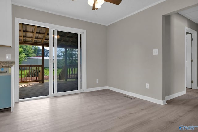 2221 Old Union Rd, Grant, AL 35747 - spare room featuring wood finished floors, a ceiling fan, baseboards, and crown molding