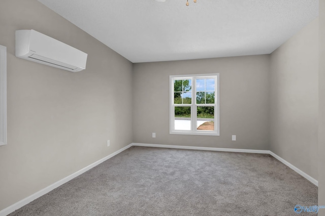 2221 Old Union Rd, Grant, AL 35747 - carpeted empty room featuring a wall unit AC and baseboards