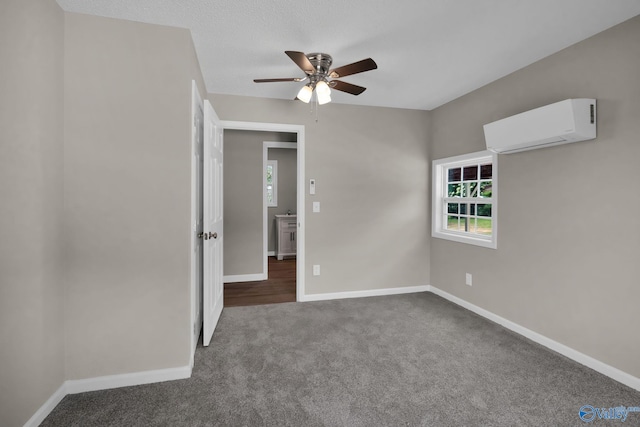 2221 Old Union Rd, Grant, AL 35747 - spare room with a wall mounted AC, a ceiling fan, carpet floors, and baseboards