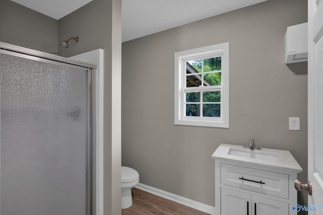 2221 Old Union Rd, Grant, AL 35747 - full bath featuring a stall shower, toilet, wood finished floors, baseboards, and vanity