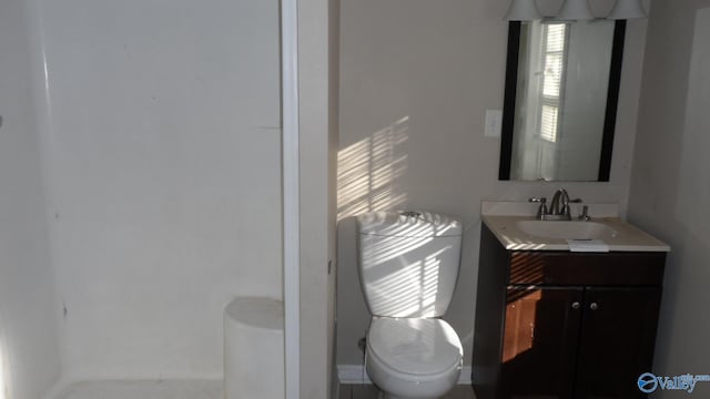 bathroom featuring vanity and toilet