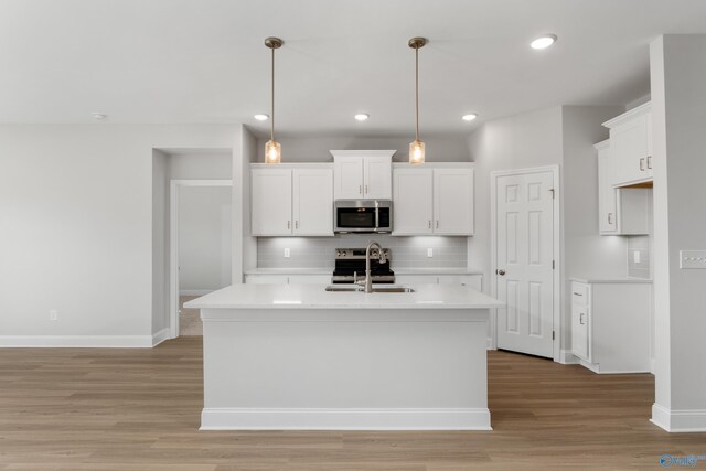 hallway with light hardwood / wood-style flooring