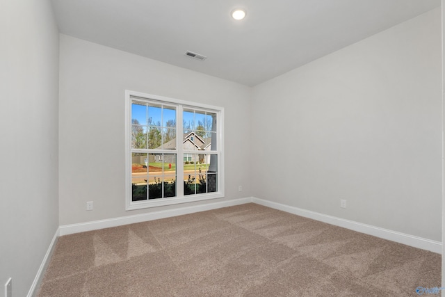 unfurnished room with carpet floors