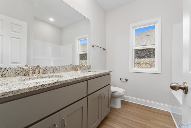 kitchen featuring pendant lighting, stainless steel appliances, a kitchen island with sink, and sink