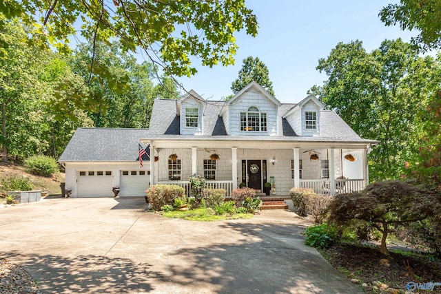 cape cod-style house featuring a garage and a porch