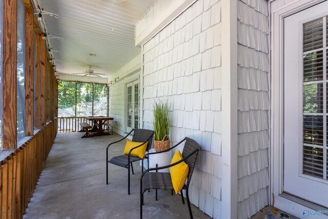 view of patio featuring ceiling fan and a porch