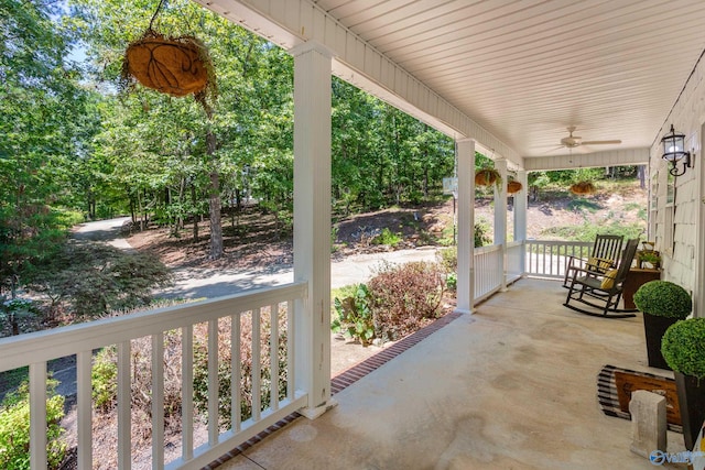 view of patio featuring ceiling fan and a porch