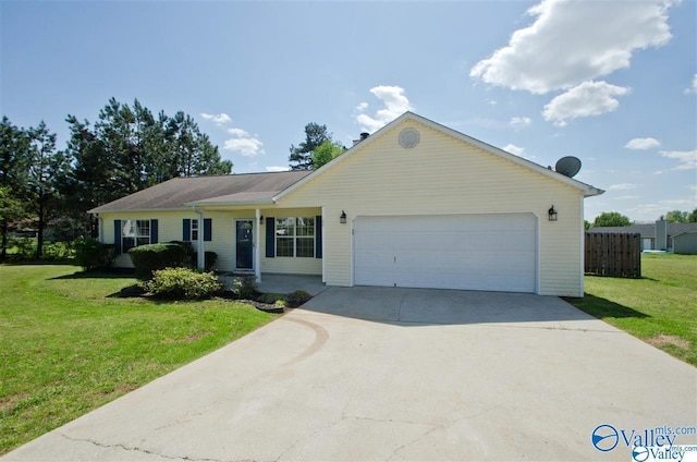 ranch-style home with a garage and a front lawn