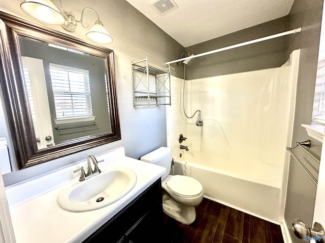 full bathroom with vanity, toilet, and shower / bathtub combination