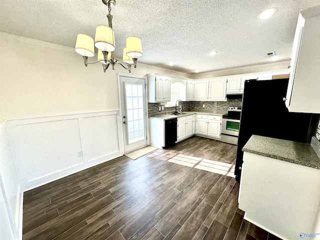 kitchen with pendant lighting, stainless steel electric range, dishwasher, white cabinets, and a notable chandelier