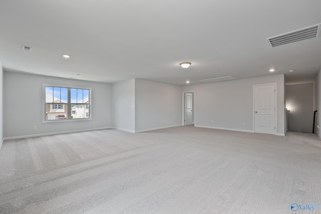 unfurnished room with light colored carpet