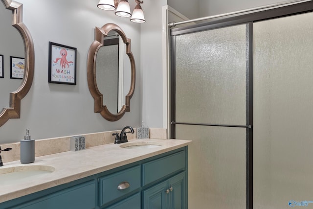 bathroom featuring vanity and an enclosed shower