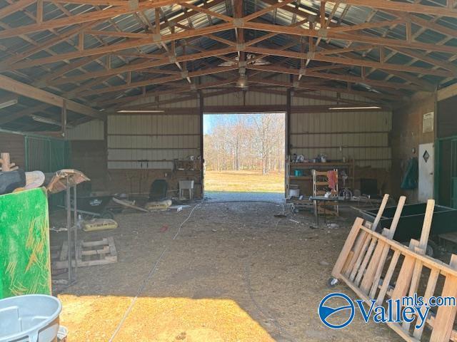 misc room with a garage and metal wall