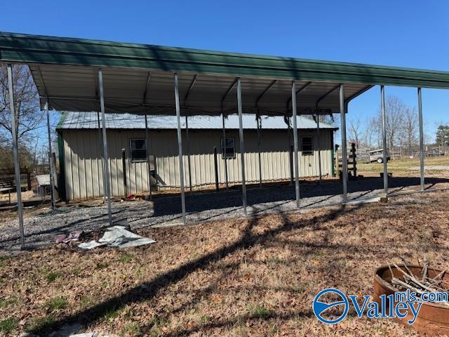 view of outdoor structure with a detached carport