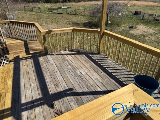 wooden deck featuring fence