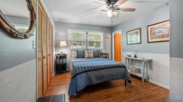 bedroom featuring a closet, wood finished floors, and ceiling fan