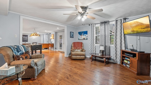 living area featuring recessed lighting, baseboards, a ceiling fan, and wood finished floors