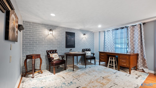 living area with wood finished floors, baseboards, and recessed lighting