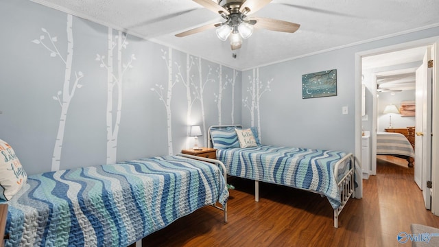 bedroom featuring ornamental molding, ceiling fan, and wood finished floors