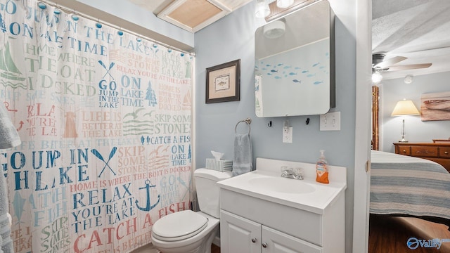 ensuite bathroom with a ceiling fan, a shower with curtain, toilet, ensuite bath, and vanity