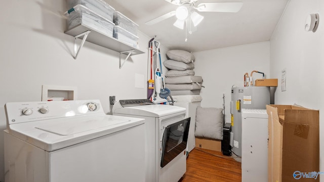 washroom with independent washer and dryer, wood finished floors, laundry area, electric water heater, and a ceiling fan