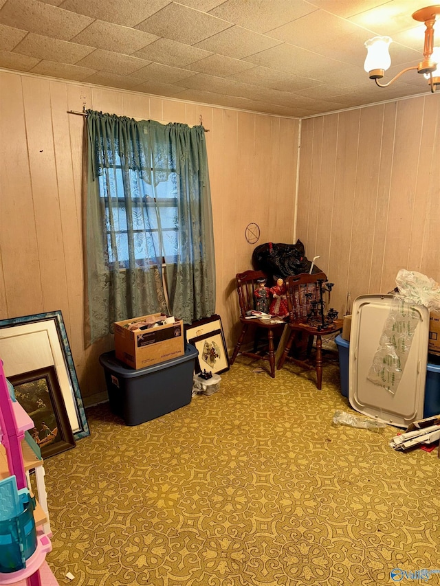 miscellaneous room featuring wooden walls