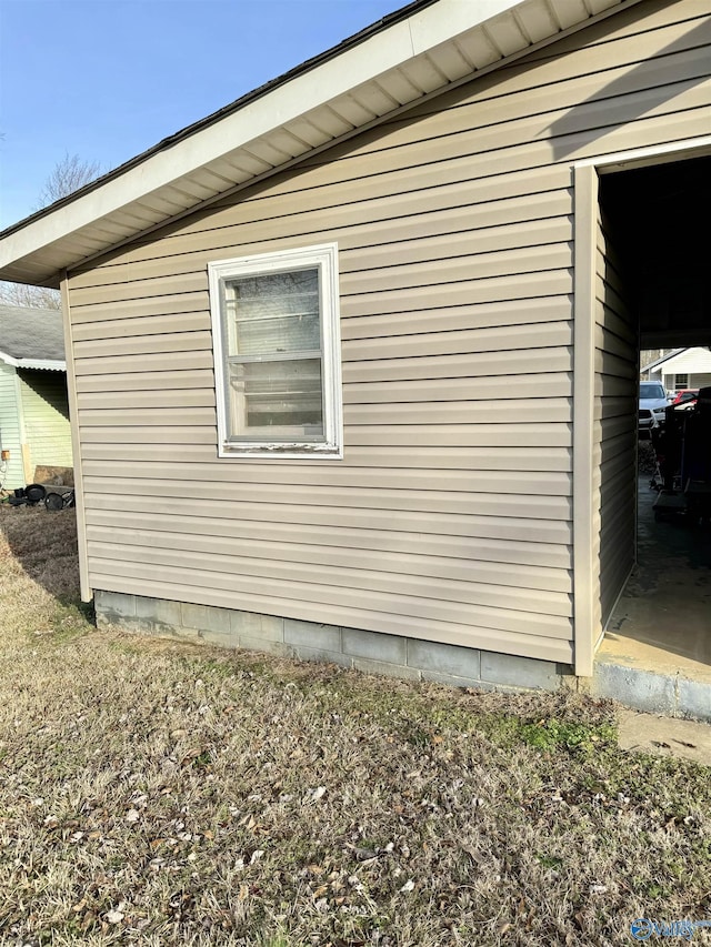 view of side of home with an outbuilding