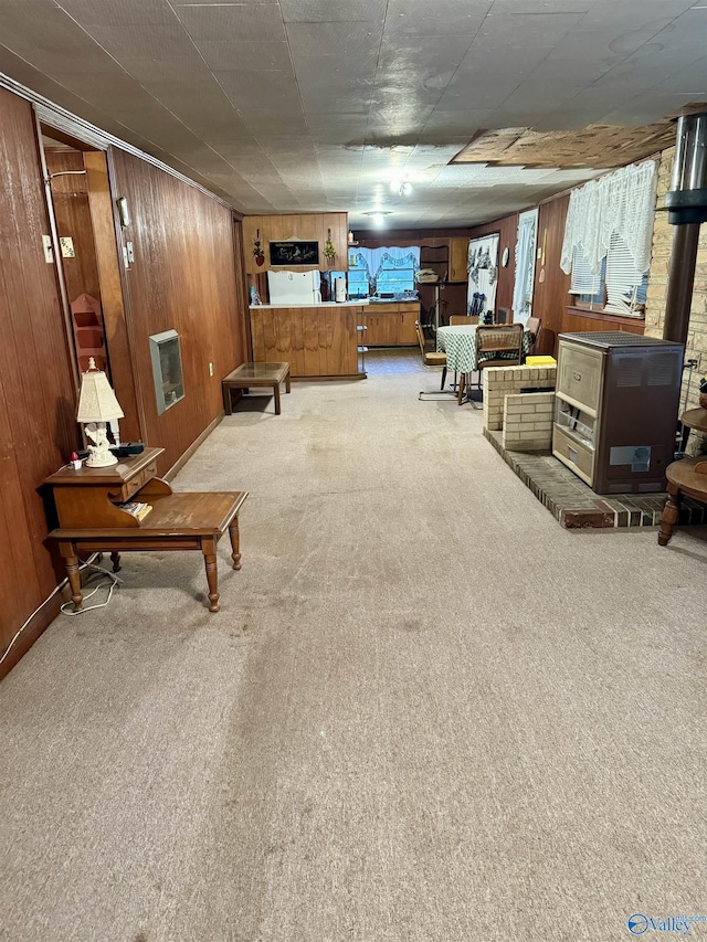 interior space with wood walls and light colored carpet