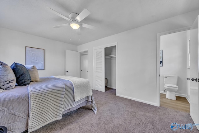 carpeted bedroom featuring ceiling fan, ensuite bathroom, and a closet