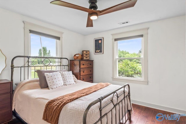 1760 Horseshoe Bend Rd, Scottsboro, AL 35769 - bedroom featuring multiple windows, dark wood-style floors, and ceiling fan