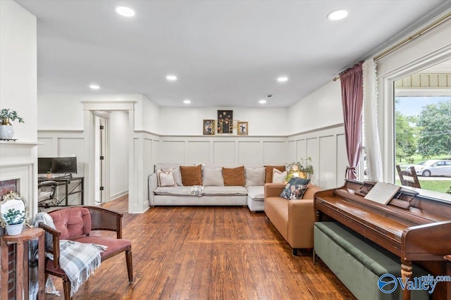 1760 Horseshoe Bend Rd, Scottsboro, AL 35769 - living room with a decorative wall, wood finished floors, wainscoting, recessed lighting, and a fireplace
