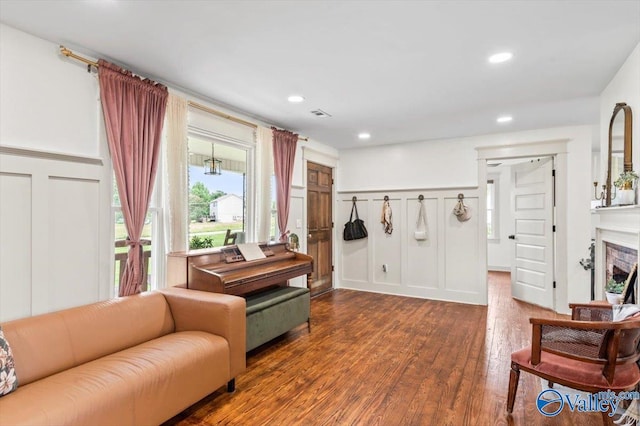 1760 Horseshoe Bend Rd, Scottsboro, AL 35769 - living area with a decorative wall, dark wood-style floors, recessed lighting, and a wainscoted wall