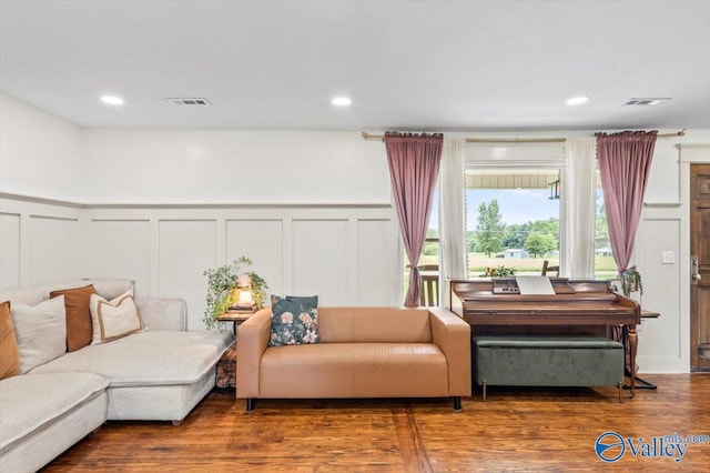 1760 Horseshoe Bend Rd, Scottsboro, AL 35769 - living room with a decorative wall, wood finished floors, a wainscoted wall, and recessed lighting