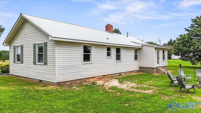 1760 Horseshoe Bend Rd, Scottsboro, AL 35769 - back of property featuring a yard, a chimney, and a metal roof