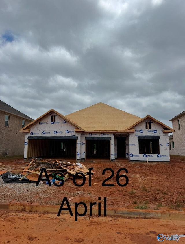 property in mid-construction with an attached garage